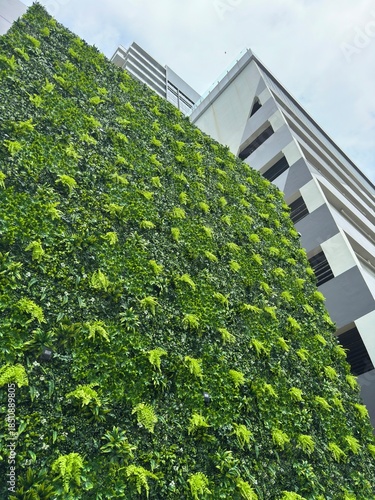 Striking green living wall adorns a contemporary urban structure showcasing innovative sustainable