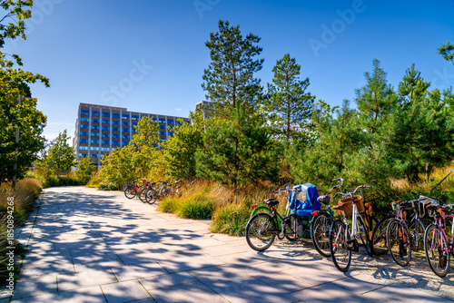 Bicycles parked in a green city square in Copenhagen. Popular eco mode of transport in Scandinavia, Denmark.