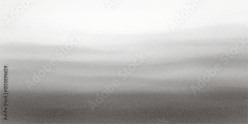 A calm black and white landscape of ocean waves under a cloudy sky where the horizon meets the sea in a serene nature travel scene