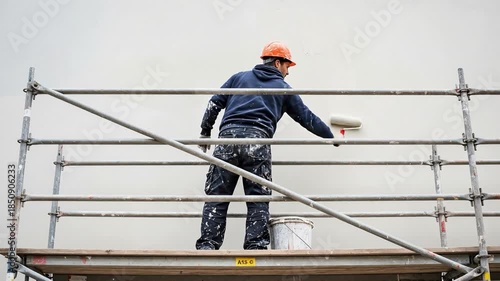 Wallpaper Mural Professional Male Painter Working on Wall with Paint Roller from Scaffold during Home Renovation Project Torontodigital.ca