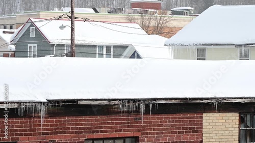Snowed in rooftops authentic natural light American town, winter weather, background video 