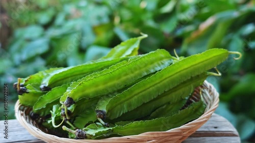 Fresh winged beans in a basket.