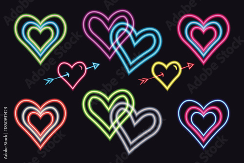 Neon heart collection with glowing colorful light symbols and cupid arrows for Valentines Day on black background.