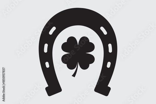 Lucky horseshoe with four‑leaf clover icon – black and white vector illustration
