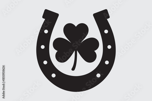Lucky horseshoe with four‑leaf clover icon – black and white vector illustration
