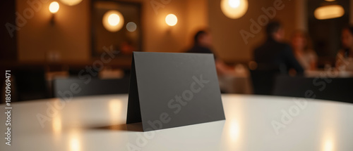 Wallpaper Mural Black menu stand on round table in restaurant setting, with soft lighting creating warm atmosphere Torontodigital.ca