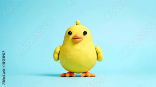 Cute Yellow Chick Clay Figure on Blue Background, Easter Concept.