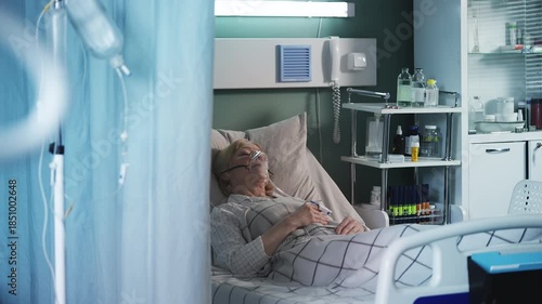 Wallpaper Mural Ill senior woman in oxygen mask lying in ICU bed, receiving intensive care Torontodigital.ca