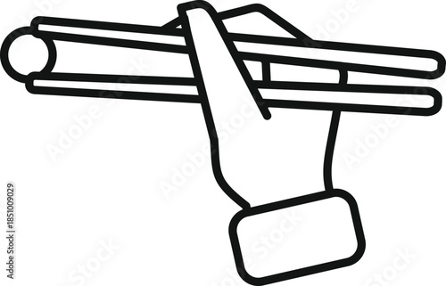 Hand holding chopsticks picking up food, representing asian cuisine and dining