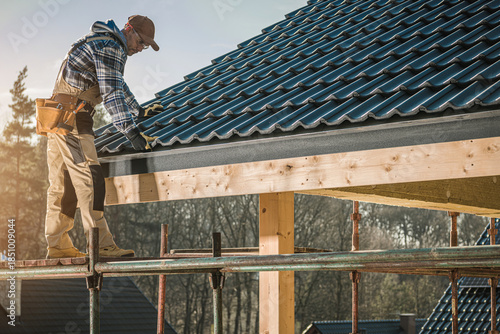 Wallpaper Mural Builder Works on Roof Installation at Construction Site During Sunny Day Torontodigital.ca