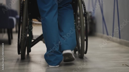 Wallpaper Mural Nurse in uniform pushing wheelchair with patient through hospital corridor Torontodigital.ca