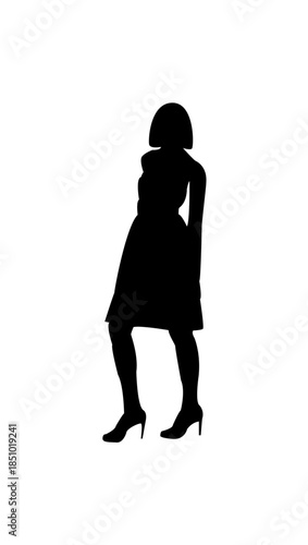 Feminine woman in short dress standing calmly, isolated white background