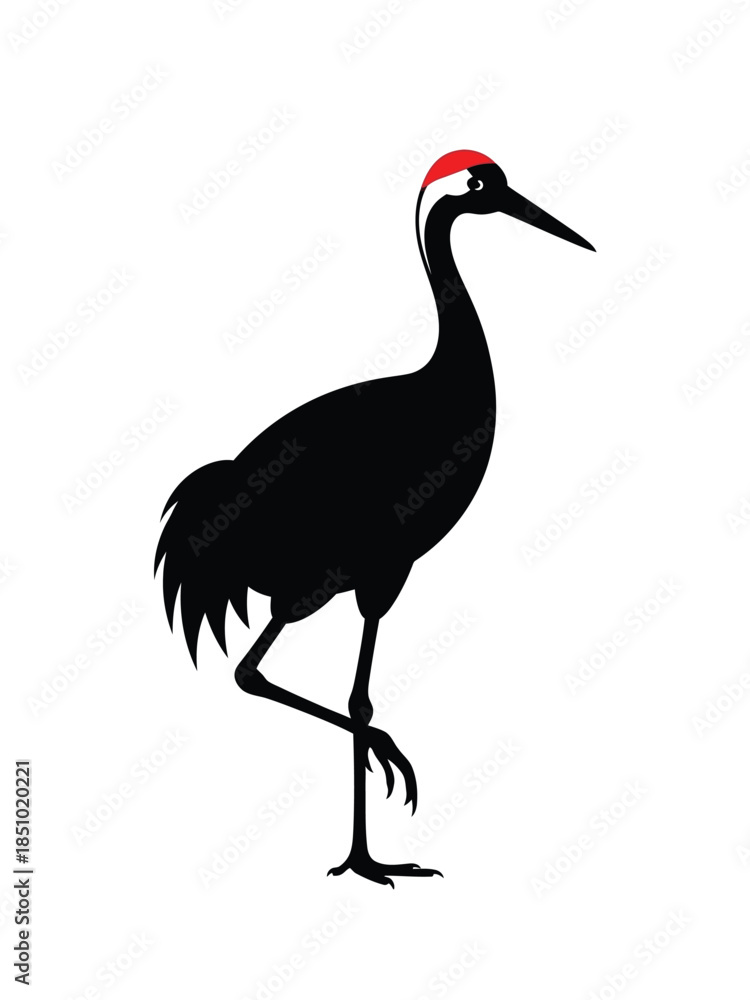 Obraz premium Silhouette of a black crowned crane standing on one leg.