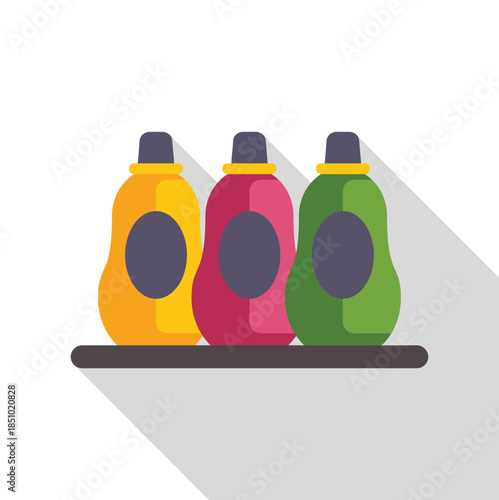 Three colorful bottles of laundry detergent and fabric softener standing on a shelf