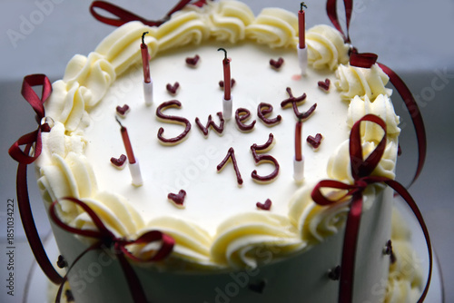 Sweet Fifteen Birthday Cake with Candles and Cream Decoration