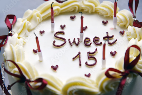 Sweet Fifteen Birthday Cake with Candles and Cream Decoration