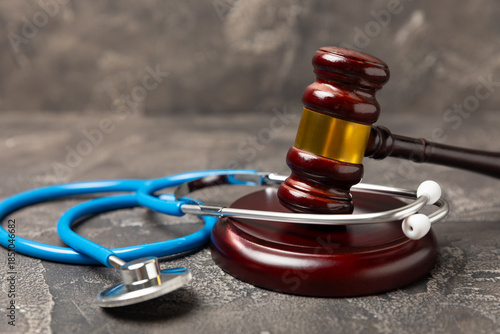 Bild auf Leinwand A stethoscope and hammer on a desk