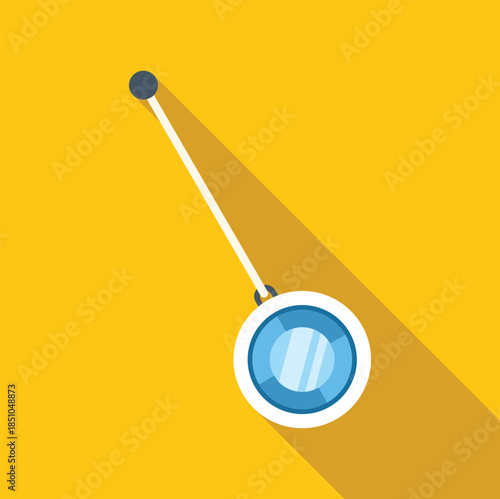 Blue and white yo yo with string showing shadow on yellow background