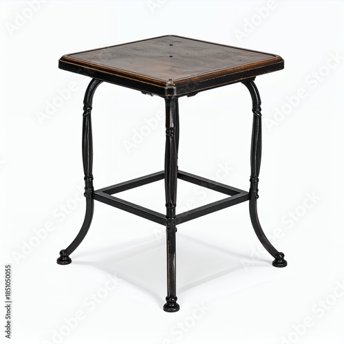 Isolated ornate metal table with wood top against clean white backdrop