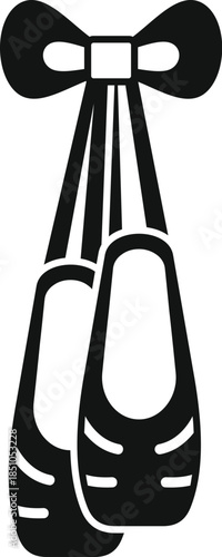 Pair of ballet pointe shoes hanging from a decorative bow