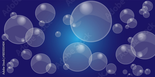 Many bubbles of various sizes on a dark blue background. large and small water bubbles.
