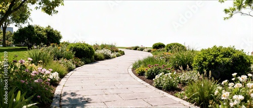 A stone paved garden path curves gently through flowering borders and green bushes in a peaceful outdoor park setting on a sunny day.