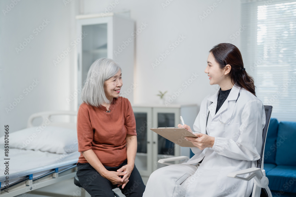 Fototapeta premium Doctor consulting senior patient during medical checkup