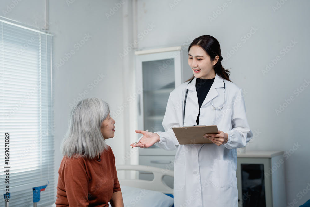 Fototapeta premium Female doctor explaining diagnosis to senior Asian patient
