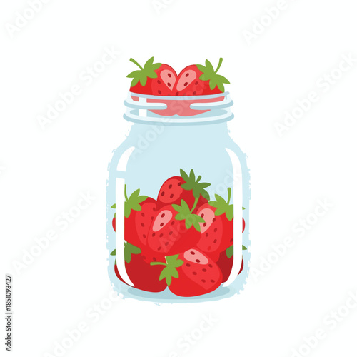 A glass jar is filled with ripe, red strawberries, ready for jam