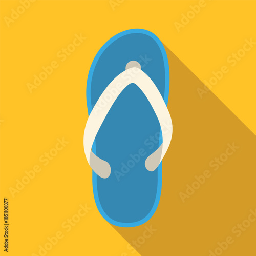 Single blue flip flop with white straps casting a long shadow on a yellow surface