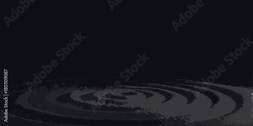 A dark image featuring concentric swirling patterns resembling ripples in water