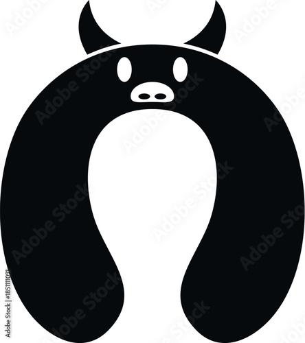 Bull shaped travel pillow in black and white featuring horns and a snout