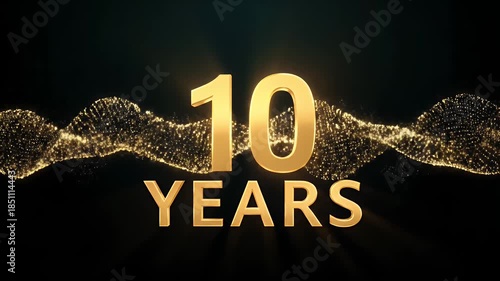 Golden 10 years anniversary text with glowing wave particles