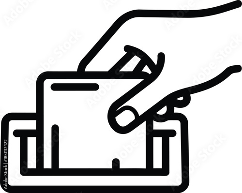 Hand inserting a credit card or debit card into a payment terminal slot for transaction