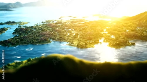 Aerial view of a lush green island landscape with bright sunlight and blue ocean water.