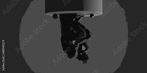 A grayscale image showing a person hanging upside down from a circular structure