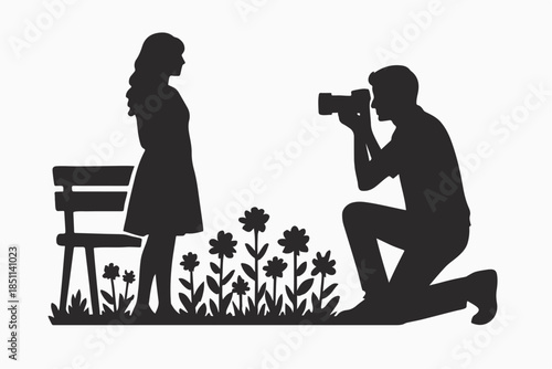 Boyfriend taking pictures of girlfriend with camera in front of flower garden