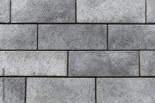 Wallpaper Mural Textured grey concrete paving stones arranged in a brick pattern Torontodigital.ca