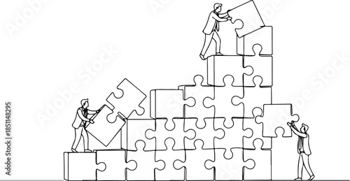 Business teamwork building puzzle together in office setting