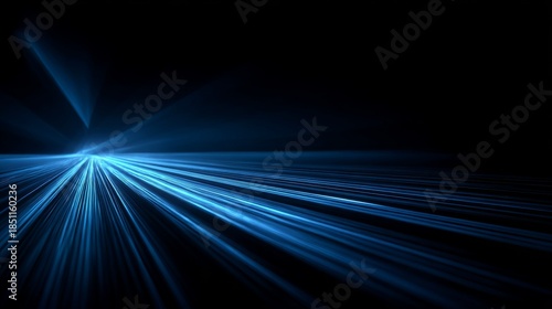 Abstract Blue Light Streaks Speeding Towards Horizon with Dark Background.