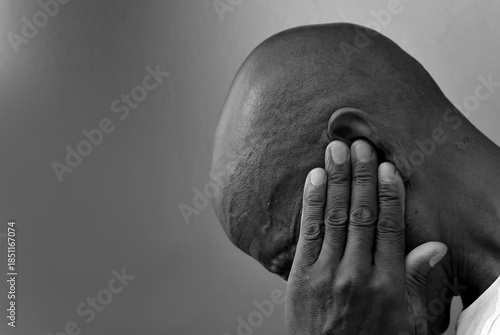 deafness suffering from deafness and hearing loss Senior man cupping his ear having difficulty hearing on gray background with people stock photo stock image
