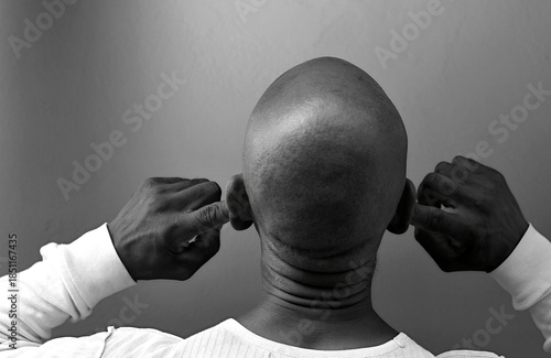 deafness suffering from deafness and hearing loss Senior man cupping his ear having difficulty hearing on gray background with people stock photo stock image