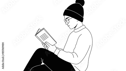Man Reading Book Wearing Beanie Hat.
