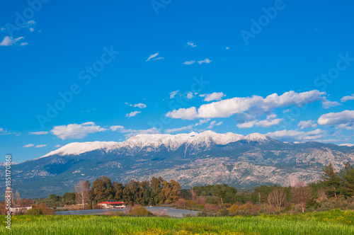 Landscape with mountains and blue sky.