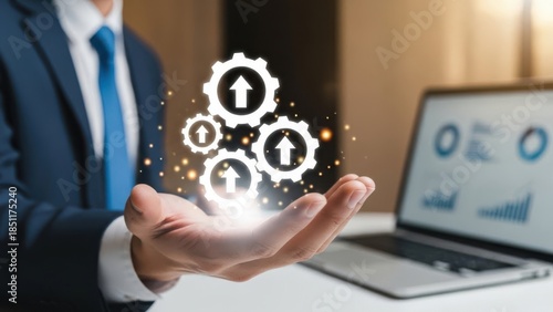 Process Workflow Efficiency: Businessman holding glowing gear icons with upward arrows for industrial automation and productivity optimization