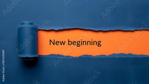 Ripped blue paper reveals bright orange background with the inspiring text new beginning symbolizing fresh starts hope and opportunity for change
