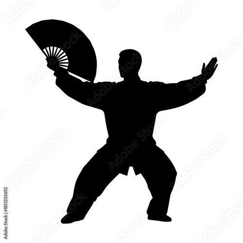 Silhouette of person practicing martial arts with fan.
