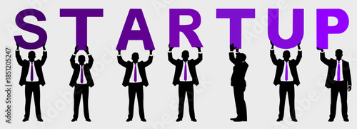 Silhouette of people holding up the word STARTUP sign