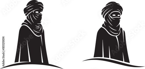 Two People Wearing Traditional Headscarves and Robes Standing Side by Side