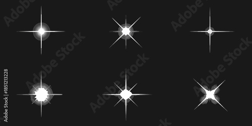 Collection of sparkling starbursts and light flares on a black background